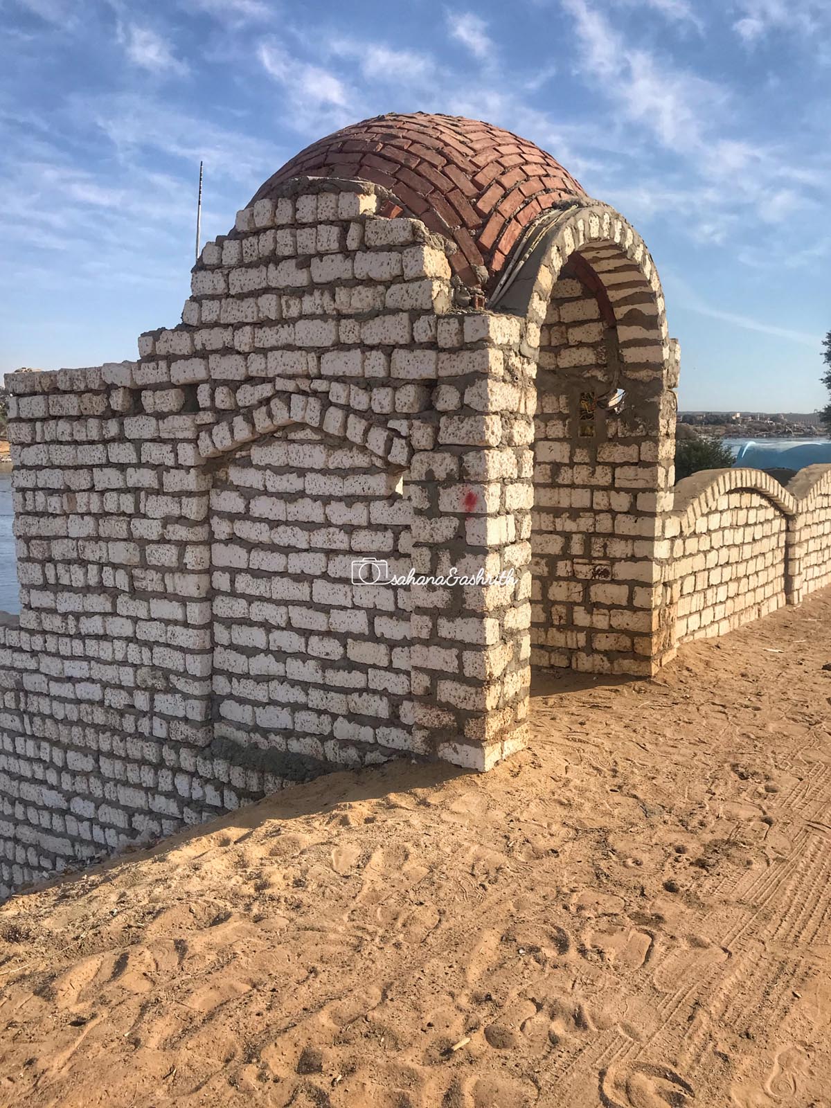 White brick wallks and a NUbian vault under construction at the Nubian village