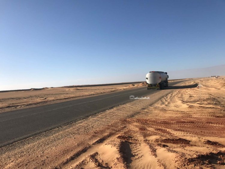 one big truck in the desert road of white desert in egypt