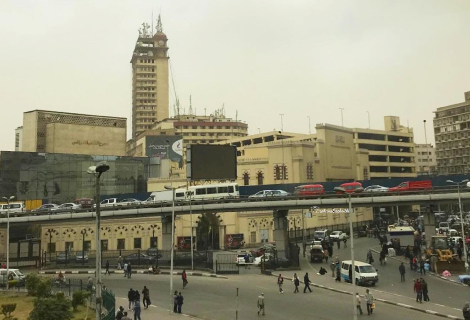 Dozens of cars slowly travelling in Egypt's Cairo flypver creating reaffic jam