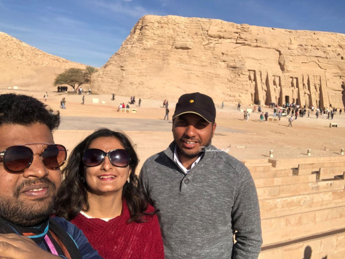 Egyptian guide with Indian travellers at Abu Simbel