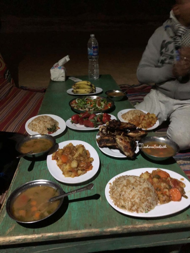 Rice, curry and grled chicken arranged on an old low height chair at Egypt's white desert