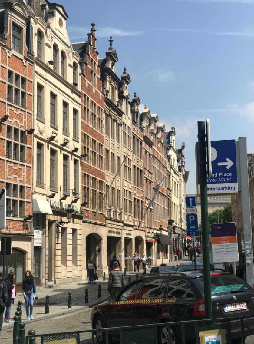 Baroque buildings made of bricks lining vehicular road at Brussels