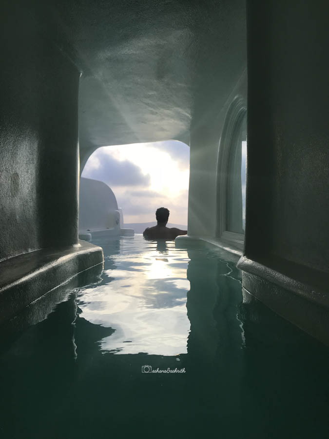 Cave pool opening to infinity at a luxury resort in Santorini