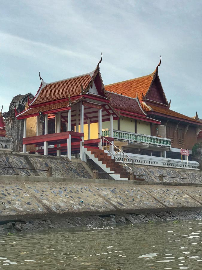 modern buddhist temple by river side in ayutthaya