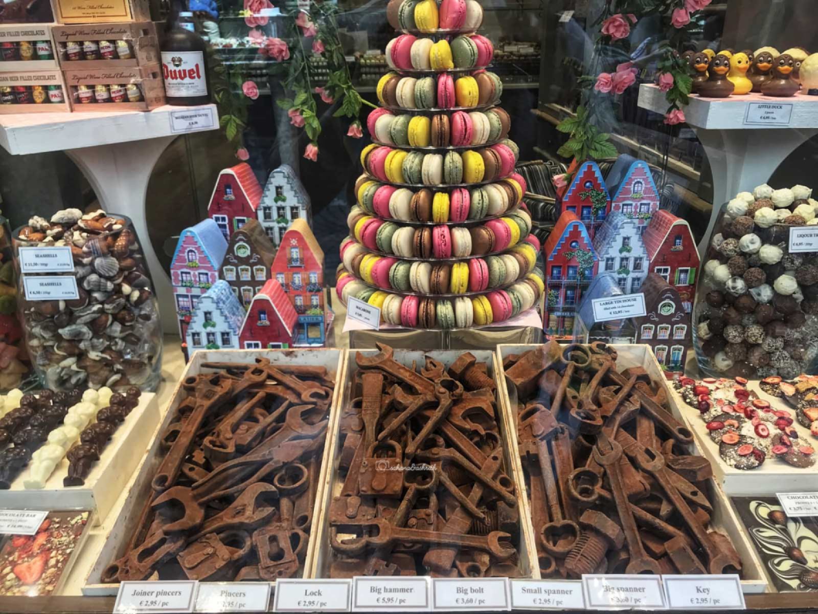 Belgian Chocolates shaped like spanners, bolts and other mechanic items and a tower of Macarons in Brussels