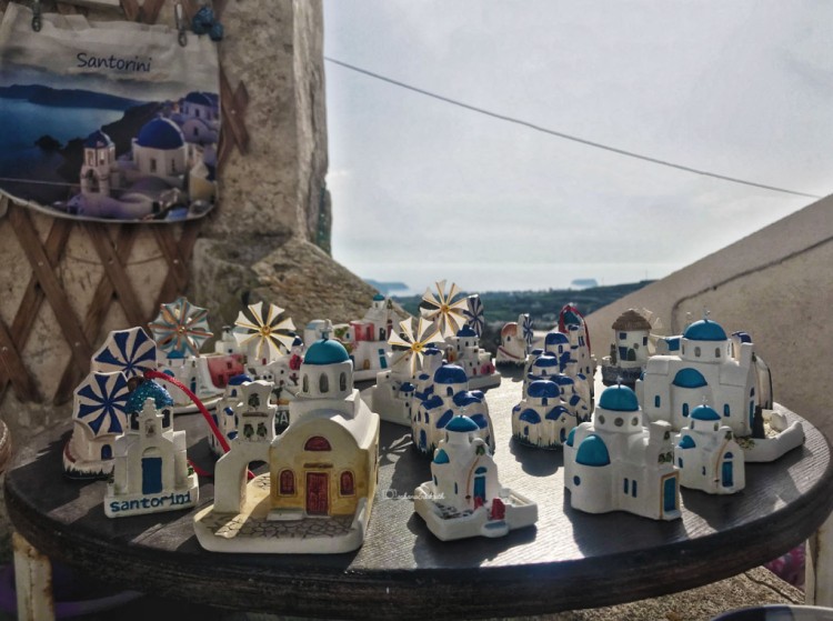 Miniature Santorini homes with white walls and blue domes