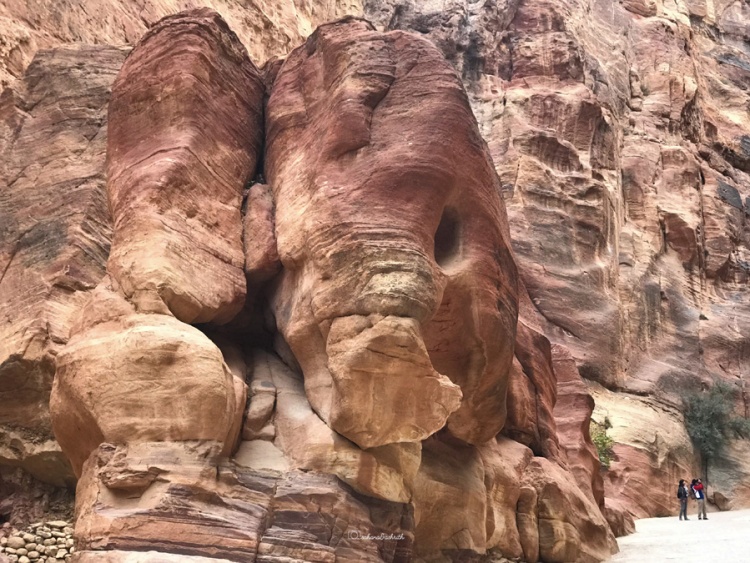 Rose colour ssanstone huge stone boulder that looks like face of elephant at the Siq, Petra