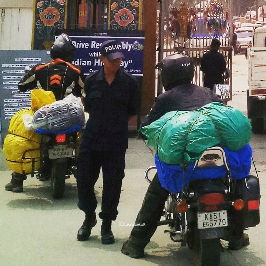 Bhutan security person checking Indian bikers crossing India-Bhutan Border