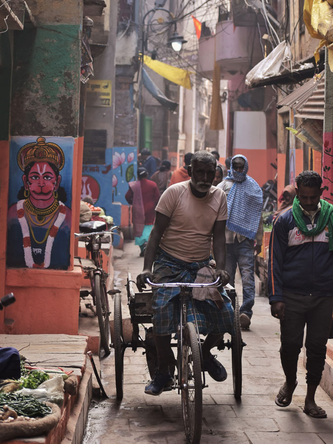 Vegetable market and a cycler in the narrow alleys of Kashi